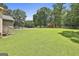 Large backyard with a shed and white fence at 100 Walnut Ct, Stockbridge, GA 30281