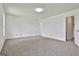 Bright and spacious bedroom with neutral carpet and access to a closet and bathroom at 100 Walnut Ct, Stockbridge, GA 30281