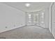 Spacious bedroom with multiple windows and carpet flooring at 100 Walnut Ct, Stockbridge, GA 30281
