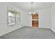 Dining room with large windows, carpet, and a chandelier at 100 Walnut Ct, Stockbridge, GA 30281