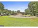 Long driveway leading to a home with an attached garage at 100 Walnut Ct, Stockbridge, GA 30281