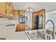 Traditional kitchen features wood cabinets, stainless appliances, and a double basin sink at 100 Walnut Ct, Stockbridge, GA 30281
