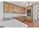Classic kitchen with wooden cabinets, white countertops, and stainless steel appliances at 100 Walnut Ct, Stockbridge, GA 30281