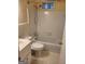 Cozy bathroom with shower-tub, white tile, and a traditional vanity at 3211 Rockview Dr, Lithonia, GA 30038