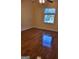 Bedroom featuring hardwood floors and a bright window at 3211 Rockview Dr, Lithonia, GA 30038