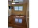 Bedroom with ceiling fan, window with blinds, and wood flooring at 3211 Rockview Dr, Lithonia, GA 30038