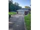 Brick home with an attached garage and a spacious driveway at 3211 Rockview Dr, Lithonia, GA 30038