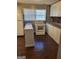 Kitchen featuring white cabinets, granite countertops, and modern appliances at 3211 Rockview Dr, Lithonia, GA 30038