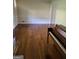 Living room featuring hardwood floors and a piano at 3211 Rockview Dr, Lithonia, GA 30038