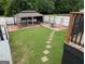 Picturesque backyard with a gazebo, lush lawn, and charming stepping stones at 1 Hemlock, Porterdale, GA 30014