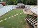 Beautiful backyard featuring a lush lawn, paved patio, and charming gazebo at 1 Hemlock, Porterdale, GA 30014