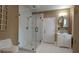 Modern bathroom highlighting a glass shower, vanity and tile floors at 1 Hemlock, Porterdale, GA 30014