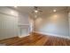 Bedroom featuring hardwood floors, built-in wardrobe, and fireplace at 1 Hemlock, Porterdale, GA 30014