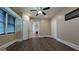 Bedroom featuring built-in closets, a ceiling fan, and plenty of natural light at 1 Hemlock, Porterdale, GA 30014
