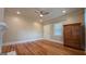 Bedroom with hardwood floors, wooden storage, and a bright window at 1 Hemlock, Porterdale, GA 30014