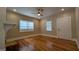 Inviting bedroom features hardwood floors, natural light, and neutral decor at 1 Hemlock, Porterdale, GA 30014