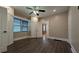 Bedroom boasting storage cabinets, ceiling fan and a clear view into another room at 1 Hemlock, Porterdale, GA 30014