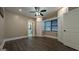 Bedroom showcases a closet, a ceiling fan and a clear view into the bathroom at 1 Hemlock, Porterdale, GA 30014