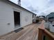 Spacious wooden deck with access to the home's interior at 1 Hemlock, Porterdale, GA 30014