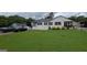 Spacious single-story home with a lush front lawn and driveway, perfect for Gathering living at 1 Hemlock, Porterdale, GA 30014