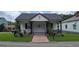 Charming home featuring a brick path and well-manicured lawn at 1 Hemlock, Porterdale, GA 30014