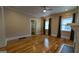 Cozy living room with hardwood floors, ceiling fan, and window with blinds at 1 Hemlock, Porterdale, GA 30014