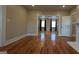 Bright living room featuring hardwood floors, neutral walls, and fireplace with an open concept at 1 Hemlock, Porterdale, GA 30014
