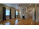 Inviting living room with hardwood floors, fireplace with stone accents, and bright windows at 1 Hemlock, Porterdale, GA 30014