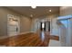 Light-filled living room showcasing hardwood floors, recessed lights, and fireplace at 1 Hemlock, Porterdale, GA 30014