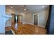 Open living room with hardwood floors, ceiling fan, and neutral paint at 1 Hemlock, Porterdale, GA 30014