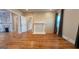 Open-concept living room with hardwood floors, fireplace, and bright natural light at 1 Hemlock, Porterdale, GA 30014