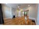 Comfortable living room with hardwood floors, fireplace with stone accents, and neutral walls at 1 Hemlock, Porterdale, GA 30014