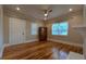 Bright living room showcasing hardwood floors and a large cabinet at 1 Hemlock, Porterdale, GA 30014