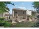 The back exterior features a sliding glass door, vinyl siding, a small patio, and a fenced-in backyard at 162 Watercress Ct, Stockbridge, GA 30281