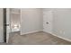 Cozy bedroom with closet space, soft carpeting, and a neutral color palette at 162 Watercress Ct, Stockbridge, GA 30281