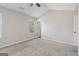 A bedroom with carpet flooring, vaulted ceilings, and natural light from a window at 162 Watercress Ct, Stockbridge, GA 30281