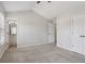 Bedroom with ensuite bathroom, carpet, closet, ceiling fan and vaulted ceiling at 162 Watercress Ct, Stockbridge, GA 30281