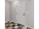 Entryway featuring checkerboard tile and neutral gray walls at 162 Watercress Ct, Stockbridge, GA 30281