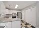 Updated kitchen featuring white cabinets, stainless steel appliances, and granite countertops at 162 Watercress Ct, Stockbridge, GA 30281