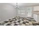 Bright kitchen featuring checkerboard floors, white cabinets, granite countertops, and stainless steel appliances at 162 Watercress Ct, Stockbridge, GA 30281
