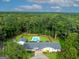 Stunning aerial view of the property showcasing the pool, house, and lush green surroundings at 396 Ebenezer Rd, Fayetteville, GA 30215