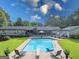 Stunning backyard with an in-ground pool, patio, and lounging chairs at 396 Ebenezer Rd, Fayetteville, GA 30215