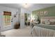 Cozy bedroom with stylish decor, a door to the outside, and a comfortable, well-lit space at 396 Ebenezer Rd, Fayetteville, GA 30215
