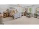 Inviting bedroom boasts large windows, plush carpeting, and custom decor at 396 Ebenezer Rd, Fayetteville, GA 30215