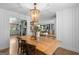Inviting dining room features hardwood floors, a wooden table, and stylish lighting fixtures at 396 Ebenezer Rd, Fayetteville, GA 30215