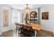 Elegant dining room featuring a large wooden table, chandelier, and stylish decor at 396 Ebenezer Rd, Fayetteville, GA 30215