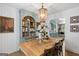 Charming dining room featuring rustic wood table, matching chairs, and vintage light fixture at 396 Ebenezer Rd, Fayetteville, GA 30215