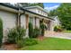 Charming home exterior with stone walkway, beautiful landscaping, and eye-catching shutters at 396 Ebenezer Rd, Fayetteville, GA 30215
