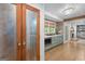 Spacious hallway with a pantry, oak floors, fireplace, and abundant natural light at 396 Ebenezer Rd, Fayetteville, GA 30215