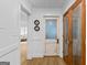 Hallway featuring a pantry and white wainscotting at 396 Ebenezer Rd, Fayetteville, GA 30215